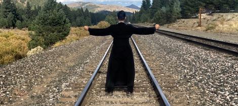 standing on the train tracks