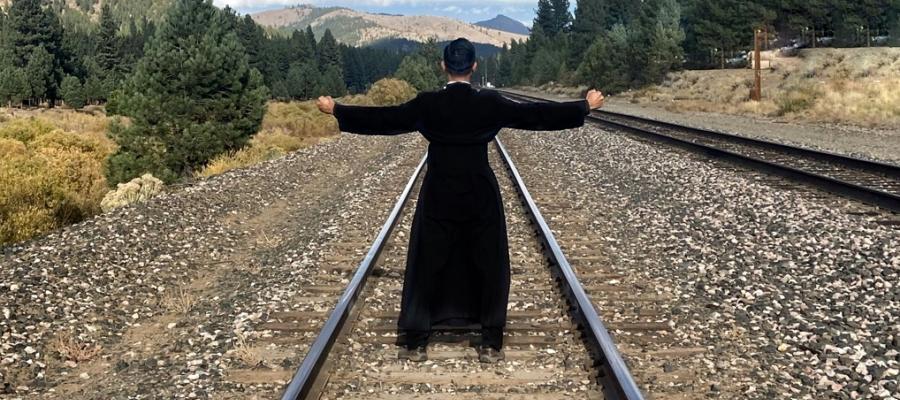 standing on the train tracks