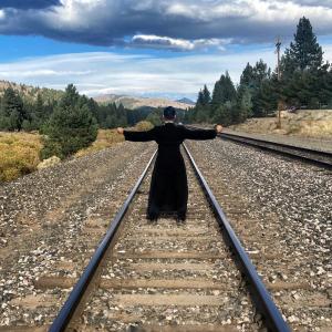 standing on the train tracks