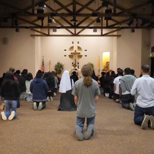 kneeling in adoration 