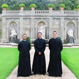 priests in a garden 