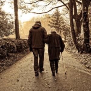 old man and lady walking 